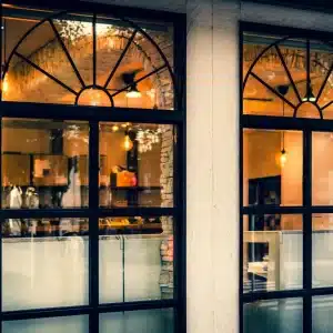 Retail storefront glazing protected with LLumar anti-graffiti window film by OOVO DFW