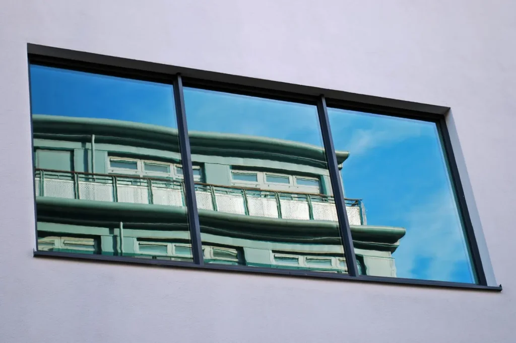 Mirrored tower glazing with LLumar Reflective window film installed by OOVO DFW