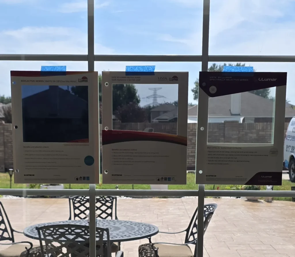 LLumar Reflective, Vista Neutral and Vista Spectrally-Selective window film samples taped to a patio window